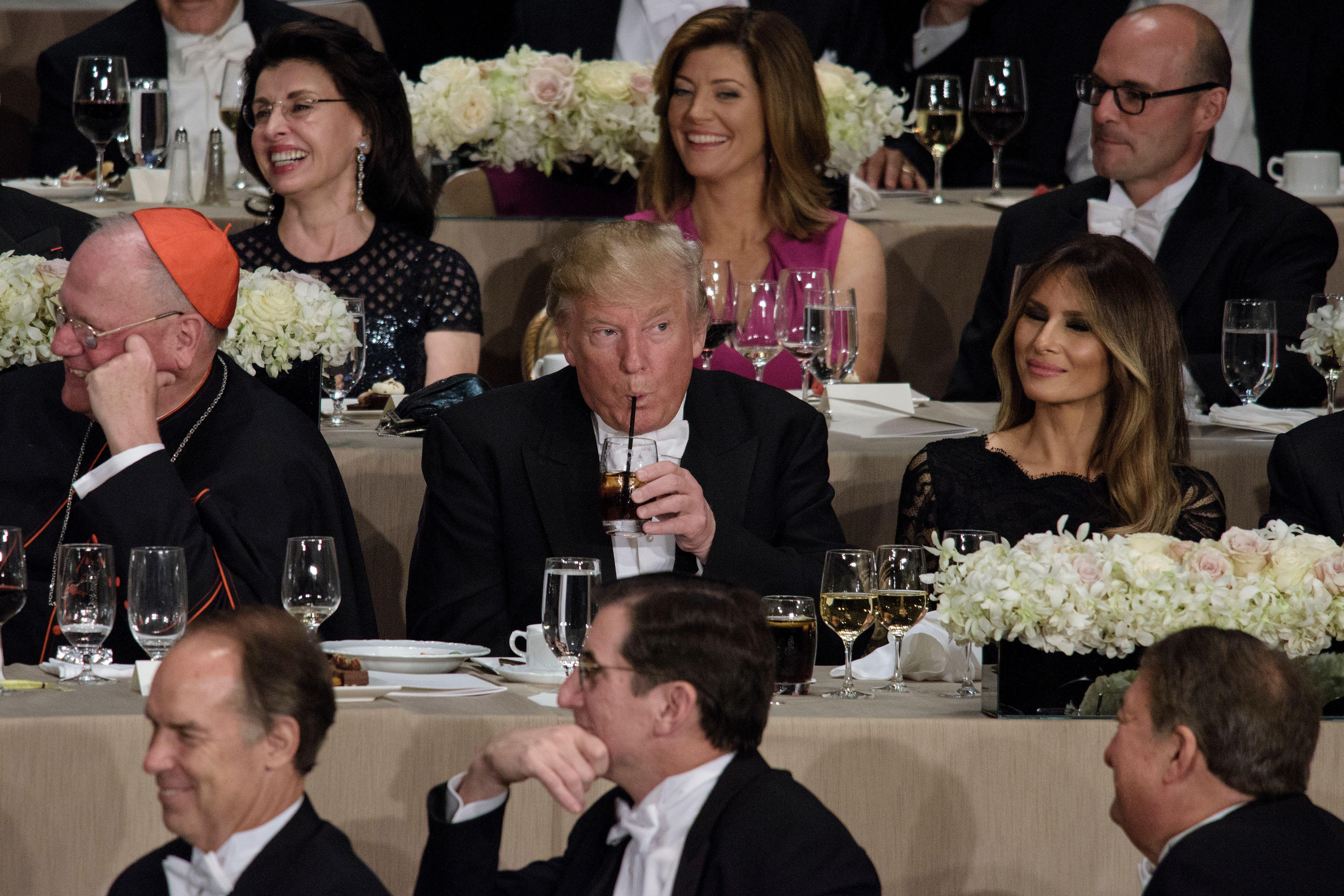 From left Cardinal Timothy Dolan, Archbishop of New York, Republican presidential nominee Donald Trump, Melania Trump and others listen as Democratic presidential nominee Hillary Clinton speaks during the Alfred E. Smith Memorial Foundation Dinner at Waldorf Astoria October 20, 2016 in New York, New York. / AFP / Brendan Smialowski        (Photo credit should read BRENDAN SMIALOWSKI/AFP/Getty Images)
