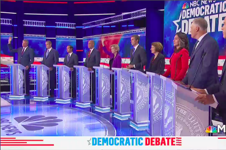 Only Bill de Blasio and Elizabeth Warren raise their hands in the row of debaters.