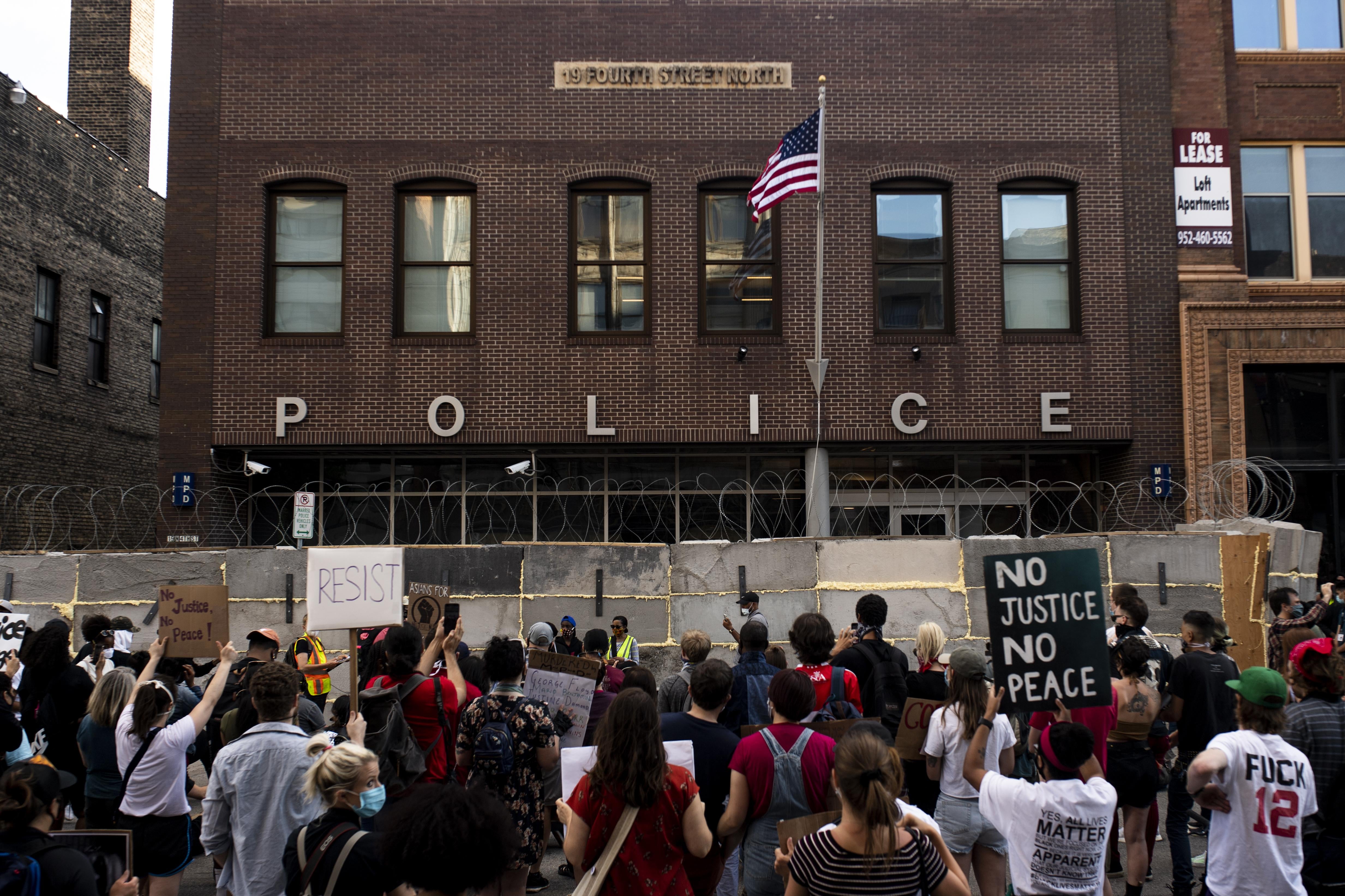 Protesters gather outside the First Police Precinct Station on June 11 in Minneapolis.