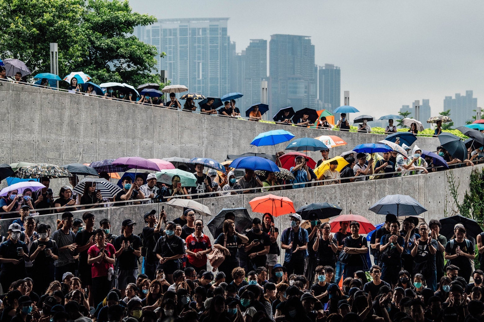 Protesters gather near the Legislative Council building ahead of the arrival of pro-democracy activist Joshua Wong who was earlier released from prison, on June 17, 2019 in Hong Kong, Hong Kong. Hong Kong pro-democracy activist, Joshua Wong, said on Monday after being released from jail that Chief Executive Carrie Lam must step down as he joined protesters against the controversial extradition bill which would allow suspected criminals to be sent to the mainland and place its citizens at risk of extradition to China. (Photo by Carl Court/Getty Images)