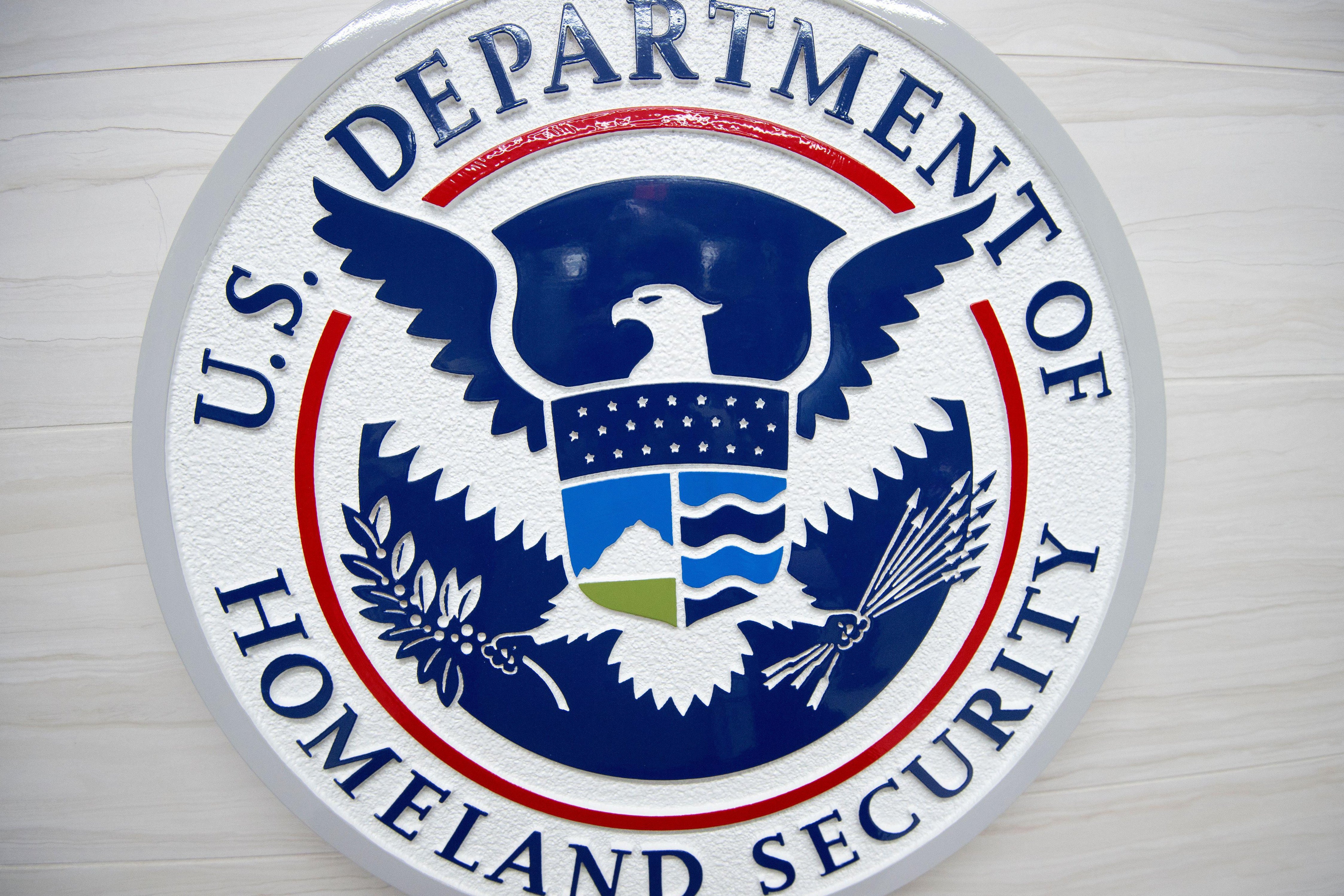 Logo of DHS on a wall.