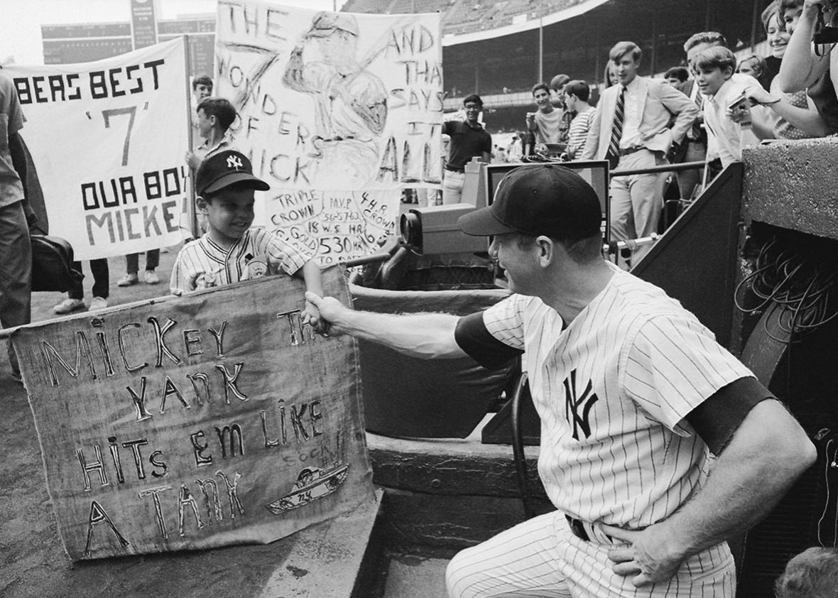 Mickey Mantle greeted by fan. 