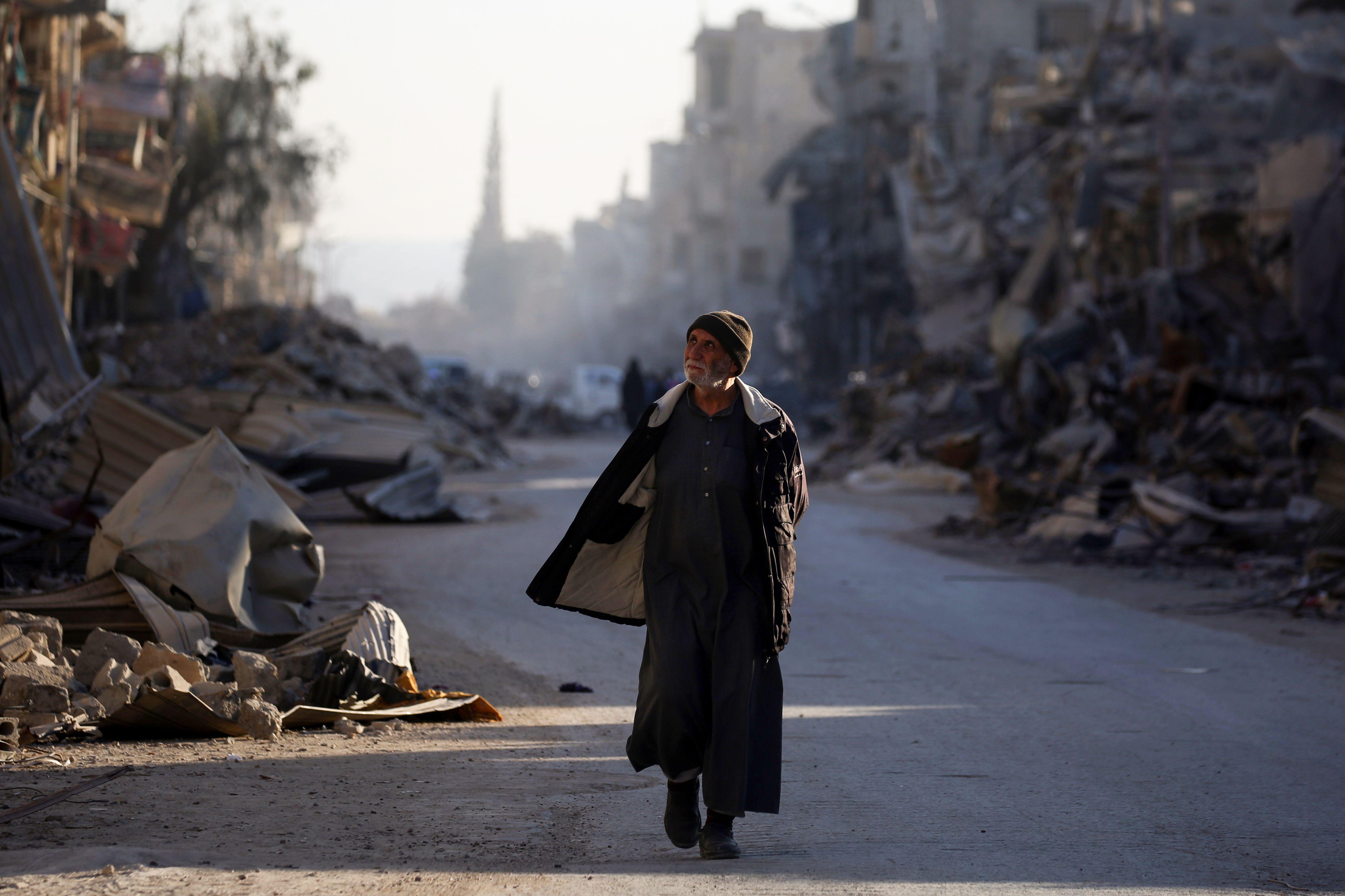A man walks through a street in Syria’s devastated city of Raqqa on Jan. 9.