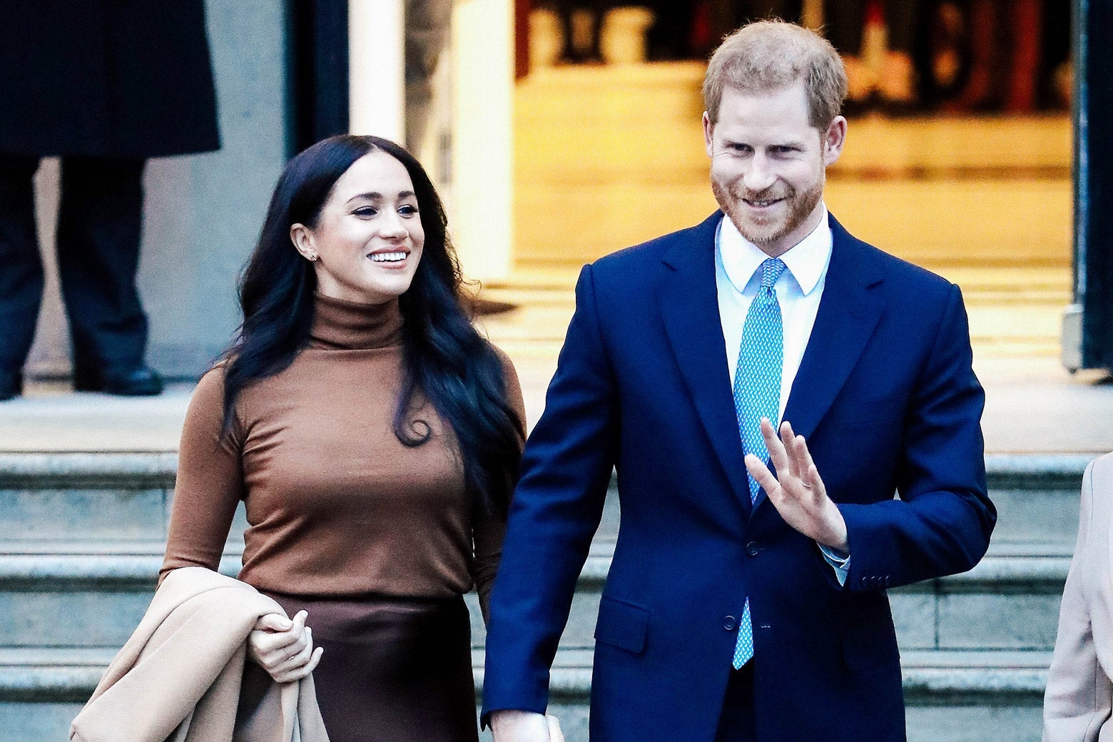 Meghan and Harry are all smiles as they depart Canada House.