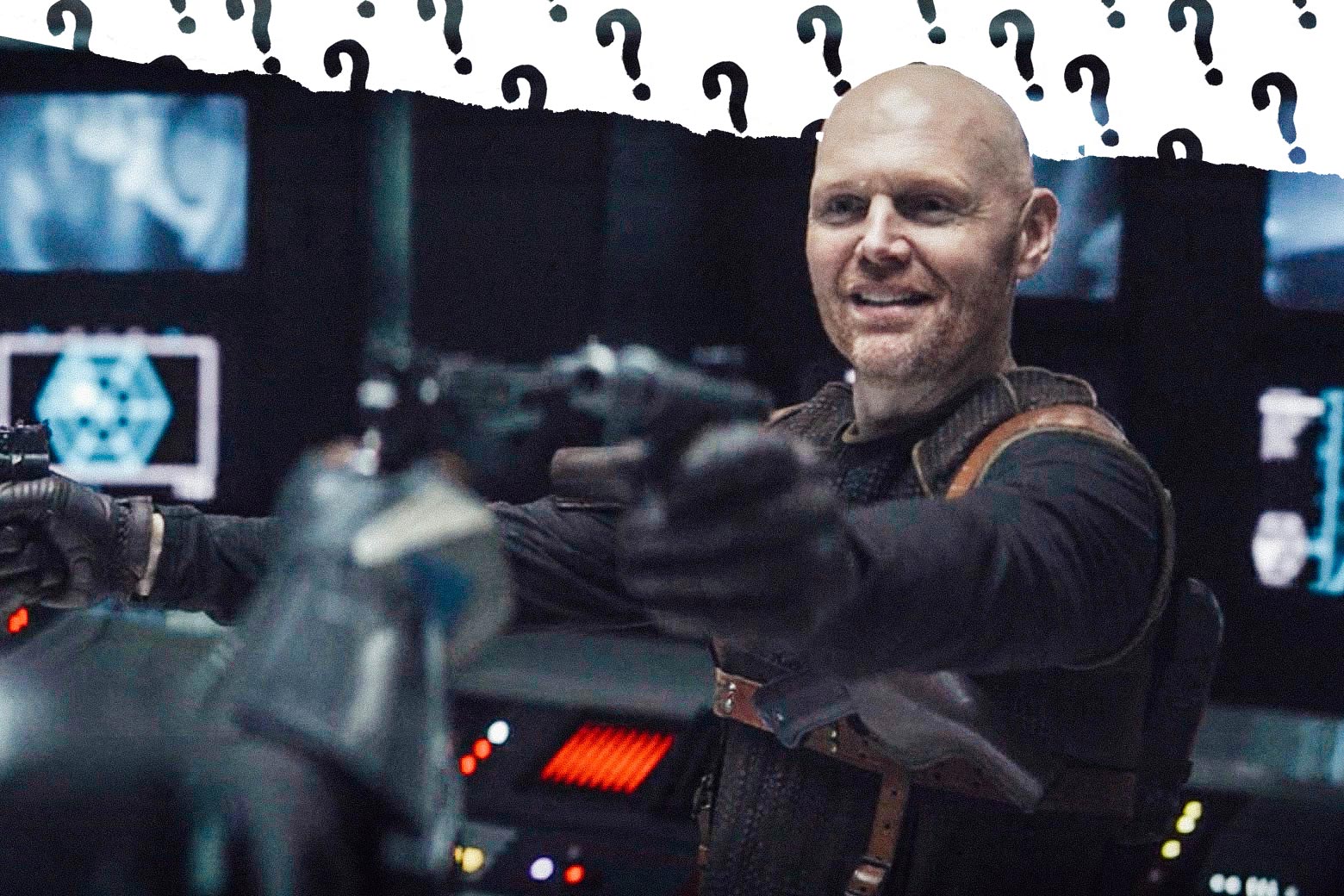 Bill Burr as Migs Mayfeld holds a blaster.