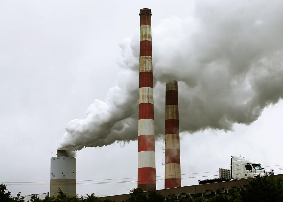 Emissions spew out of a large stack at the coal fired Morgantown Generating Station, on May 29, 2014 in Newburg, Maryland. 