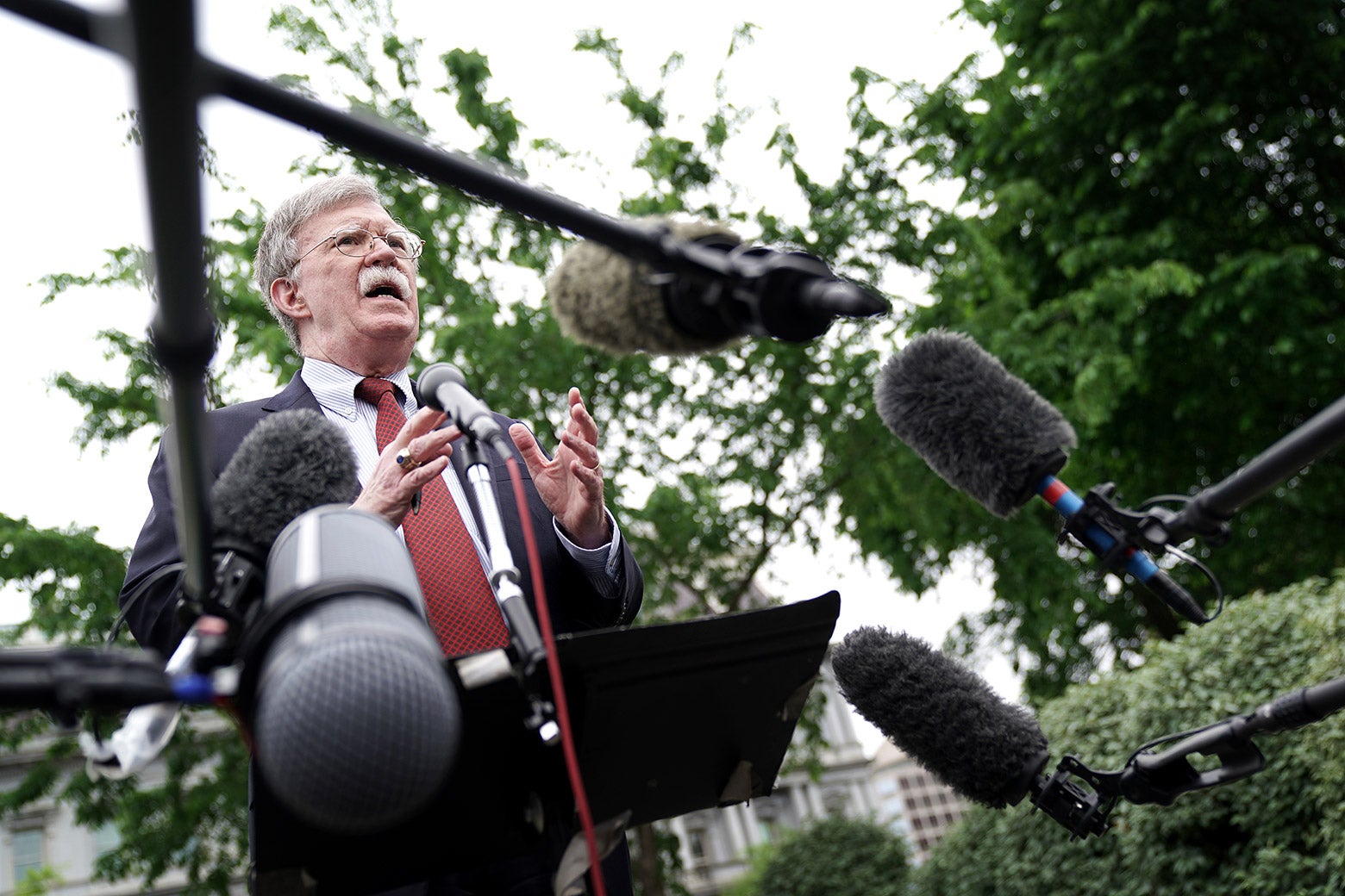 National security adviser John Bolton talks to reporters outside the West Wing on May 1 in Washington.