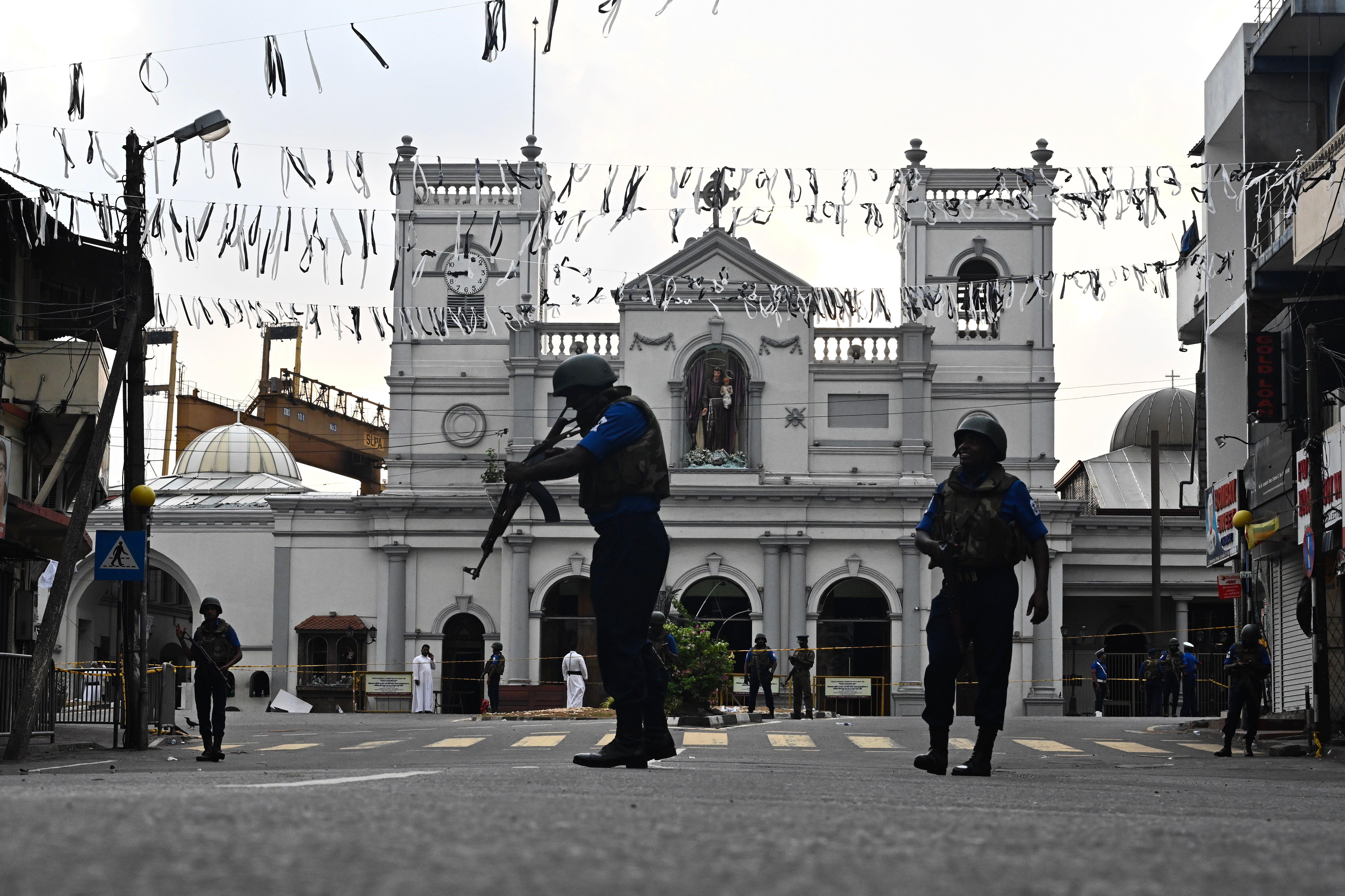 Security personnel stand guard in front of St. Anthony's Shrine in Colombo.