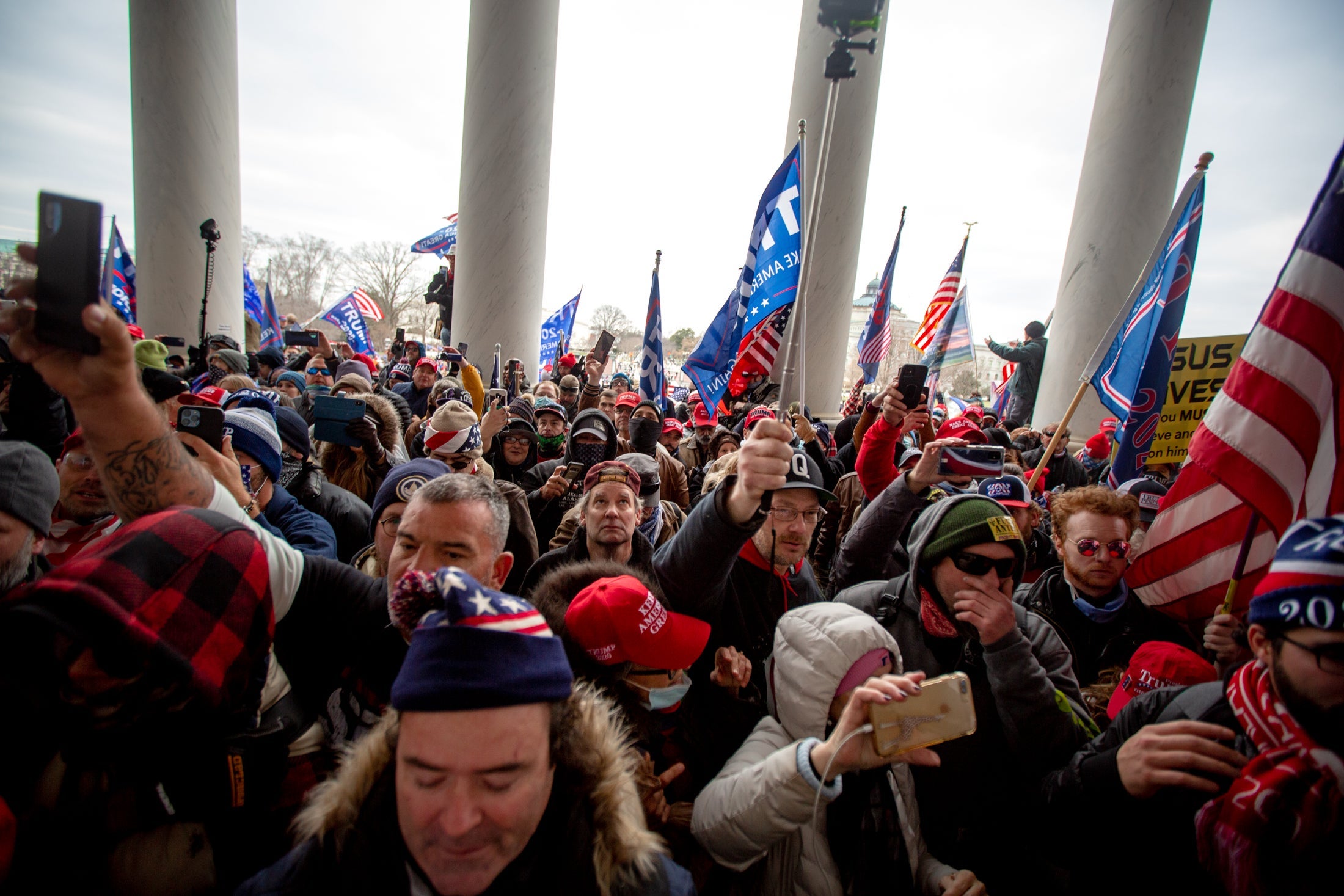Hundreds of rioters crowd the doors of the U.S. Capitol.