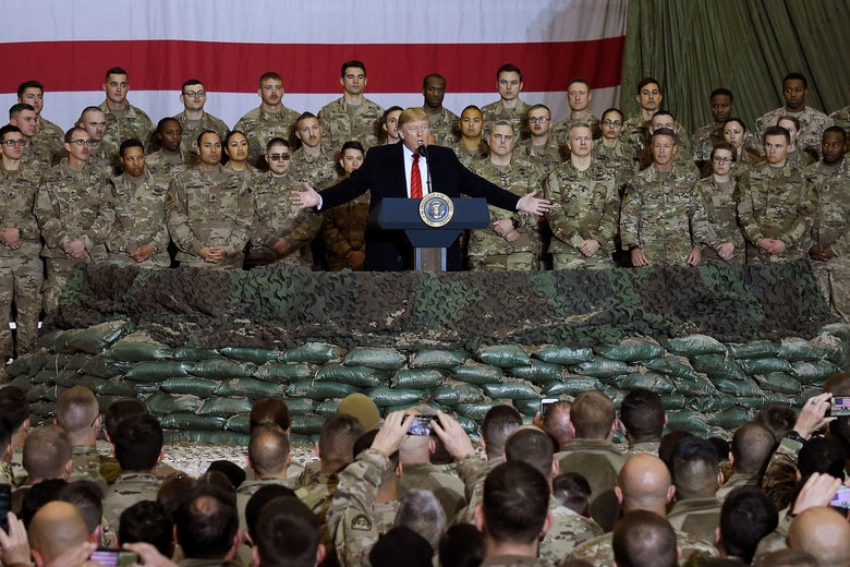 In this file photo taken on November 28, 2019, US President Donald Trump speaks to the troops during a surprise Thanksgiving day visit at Bagram Air Field in Afghanistan.