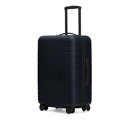A dark-blue rolling suitcase.