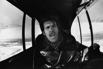 Author Richard D. Bach in cockpit of his piper cub airplane. 