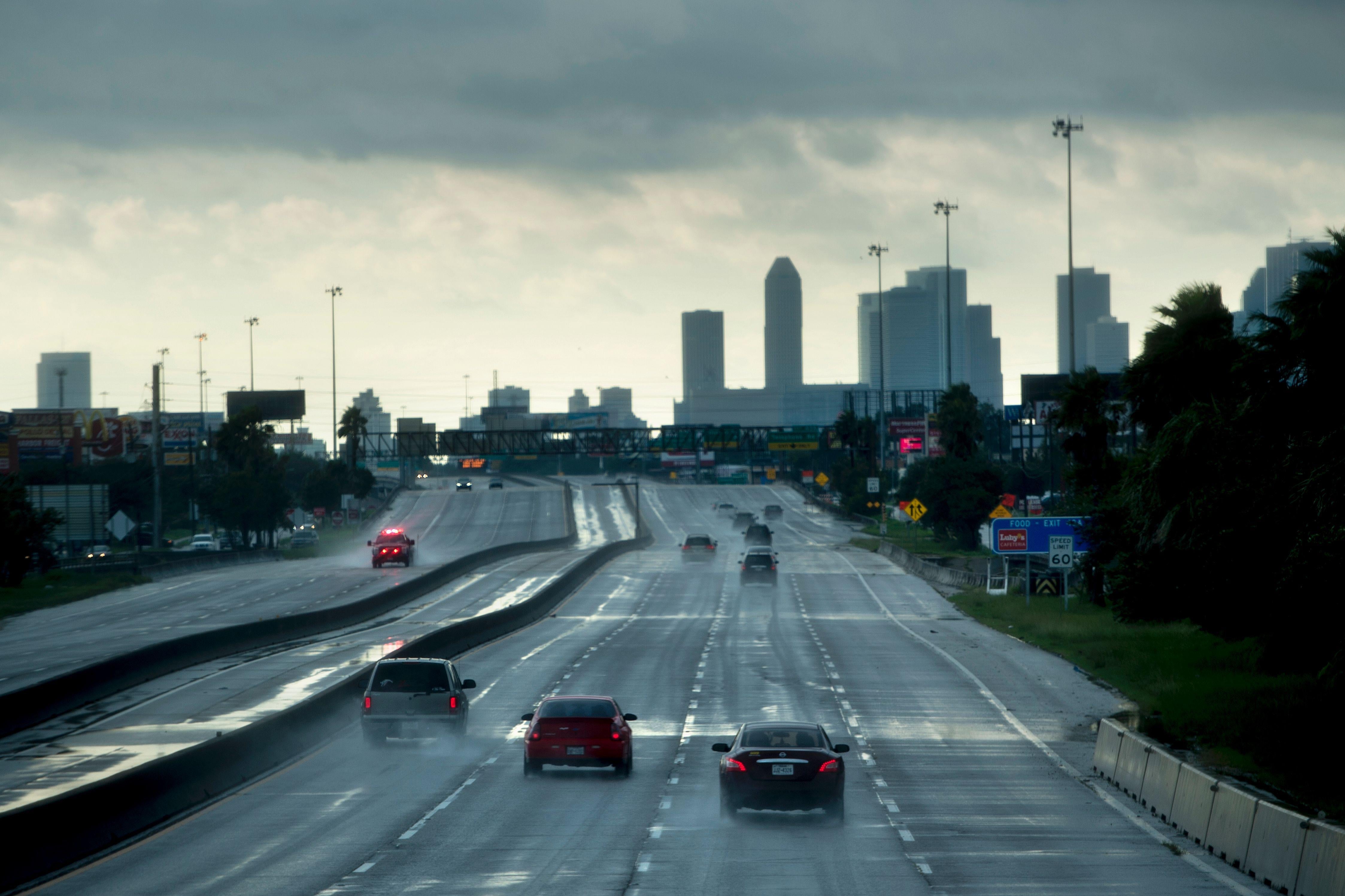 Cars are seen driving on a highway.