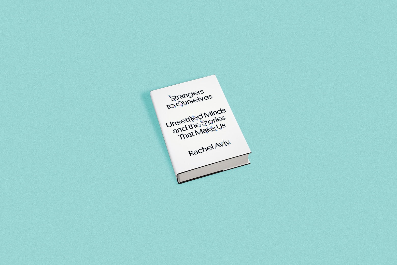 A white book cover that says "Strangers to Ourselves: Unsettled Minds and the Stories That Make Us, Rachel Aviv." The book stands against a blue background. 