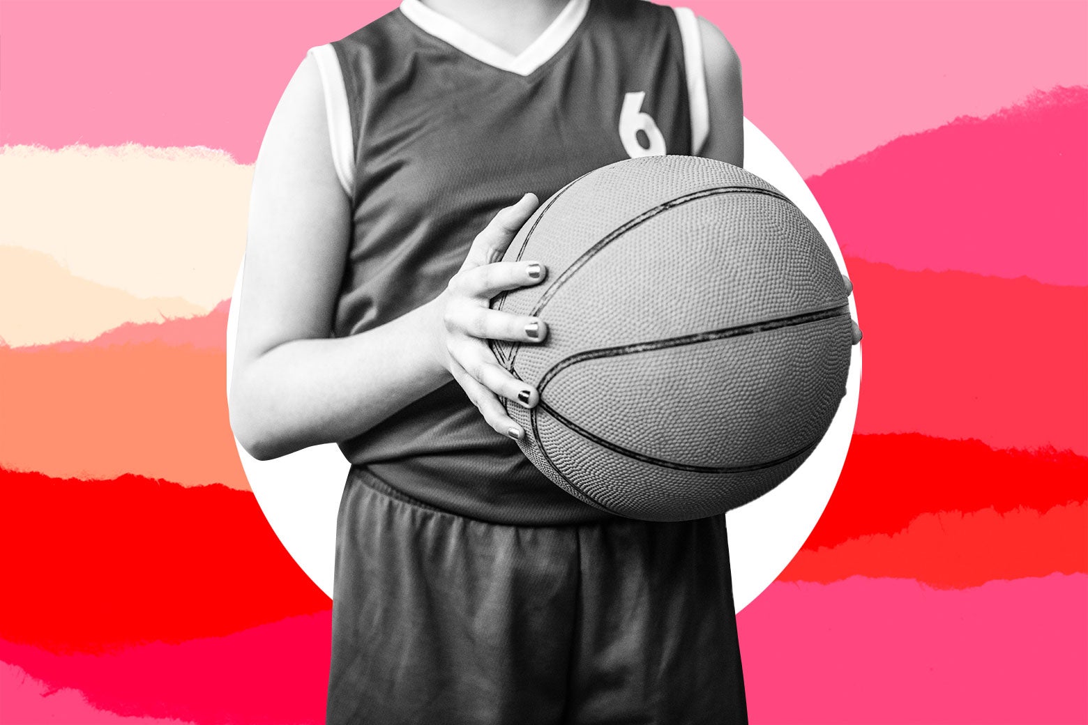 A child holds a basketball.