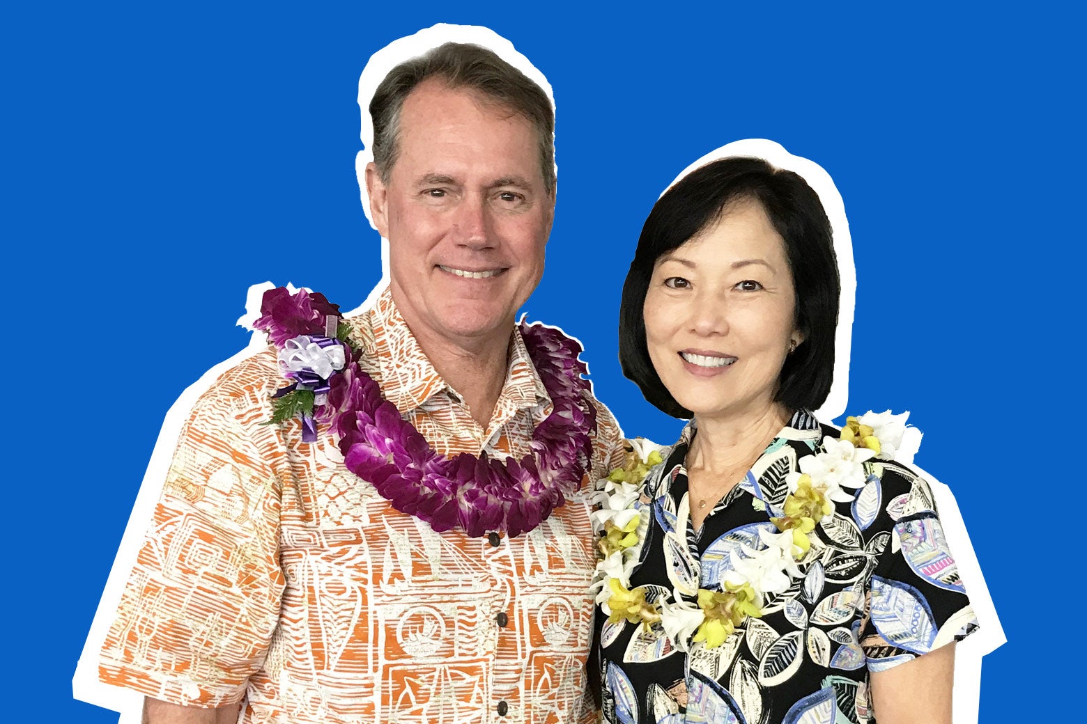 Ed Case and his wife, both wearing Hawaiian shirts and leis.