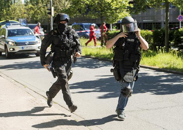 Heavily-armed police outside a movie theatre complex where an armed man has reportedly opened fire on June 23, 2016 in Viernheim, Germany.