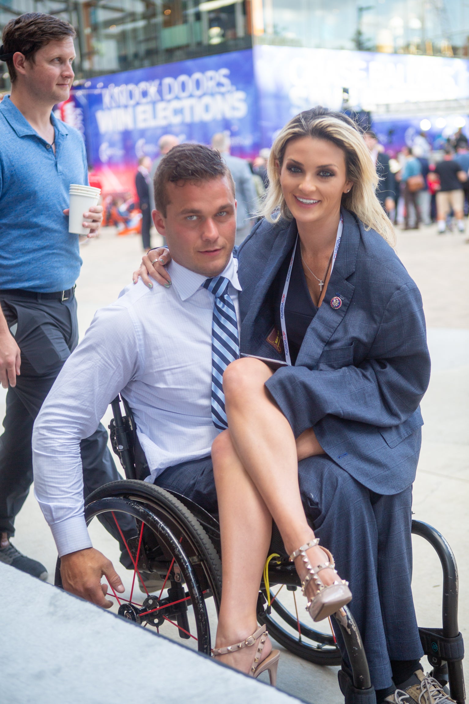 Former North Carolina Congressman Madison Cawthorn enjoying touring the RNC grounds with a passenger on his lap.