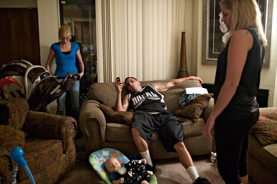 Paul lounges in his home with his girlfriend and his son after a day of shooting in Los Angeles, Aug. 12, 2009.