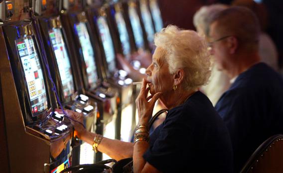 Joan Ouellette plays a slot machine in 2004 during the grand opening for the Seminole Hard Rock Hotel and Casino.