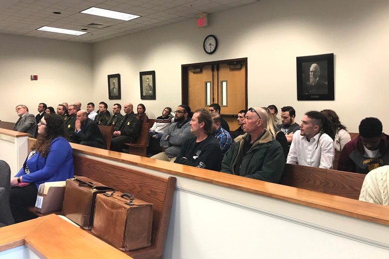 Customs and Border Protection Officer Mark Qualter testifies in Plymouth District Court as Judge Thomas Rappa looks on.