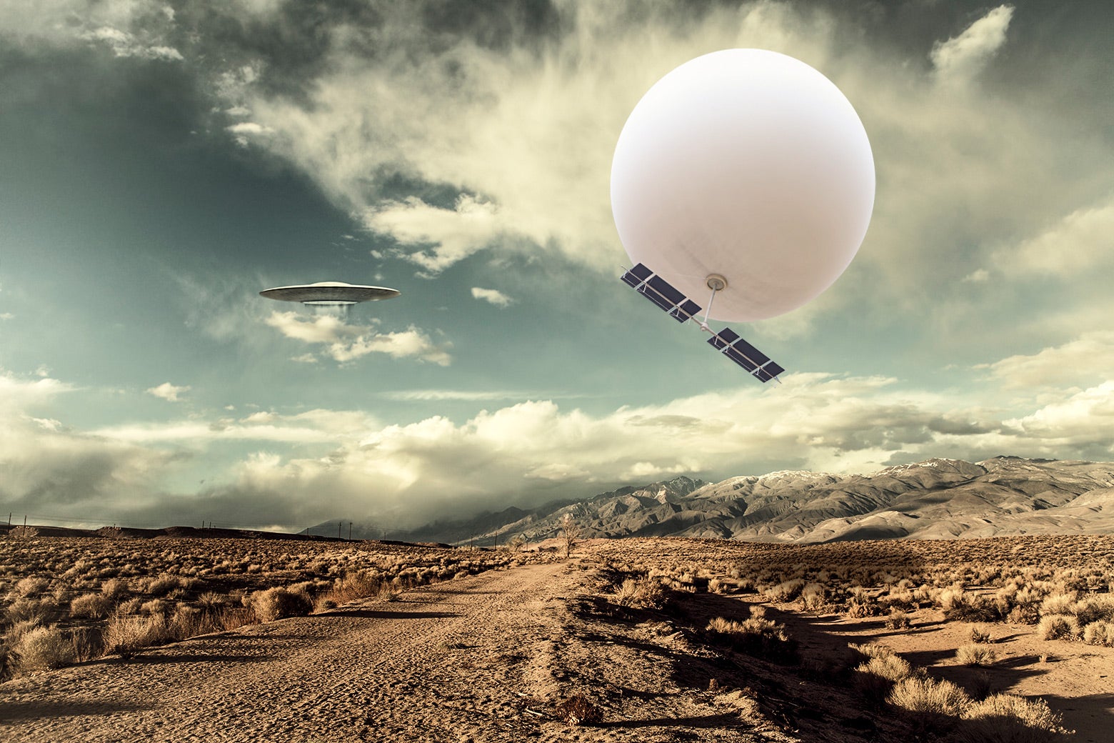 A surveillance balloon and a UFO over a desert.