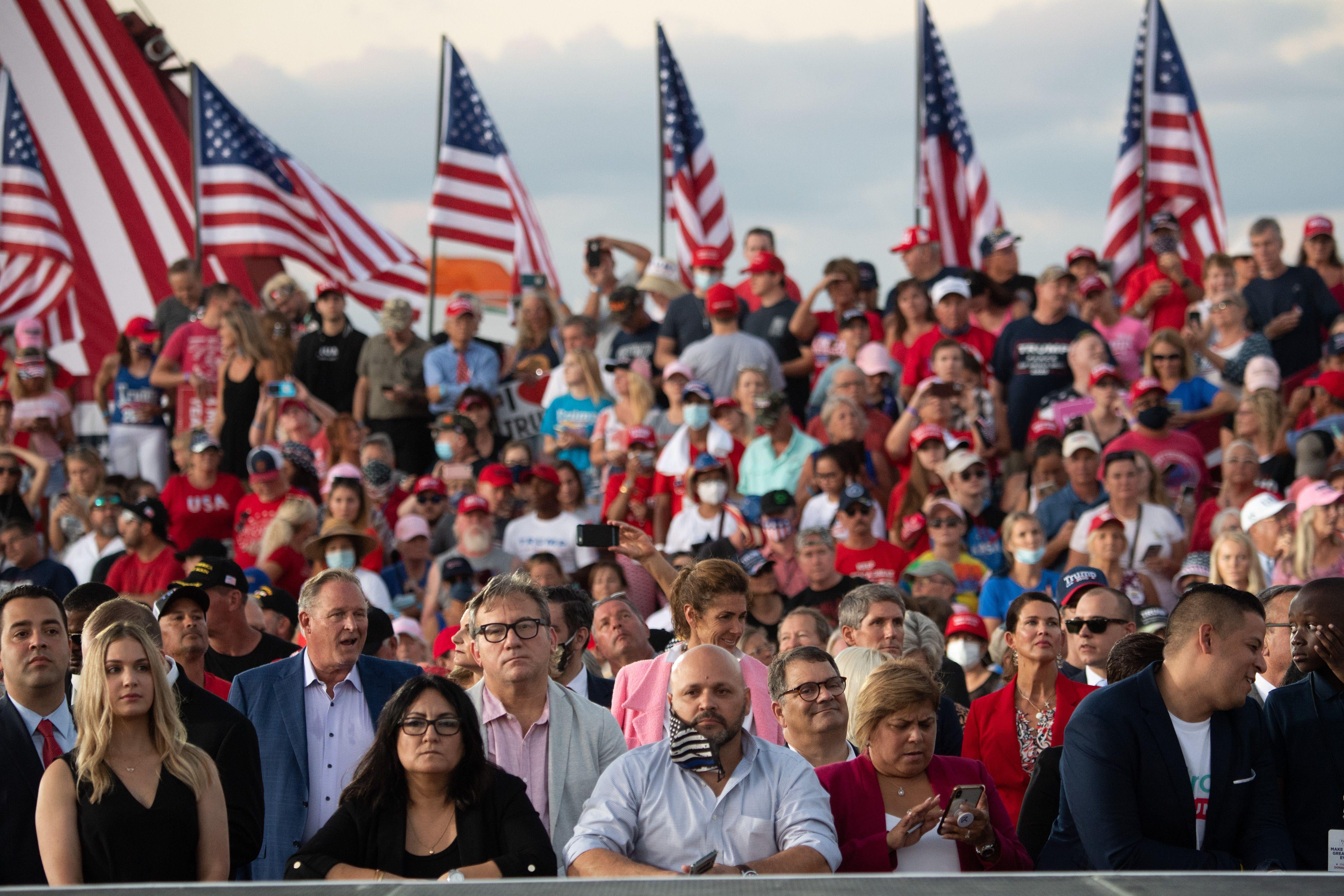 Supporters of President Donald Trump attend a Make America Great Again rally as he campaigns at Orlando Sanford International Airport in Sanford, Florida, October 12, 2020.