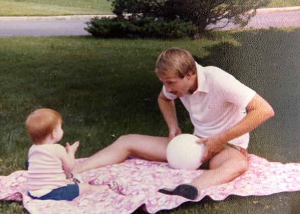 The author and her father, playing ball in the yard.
