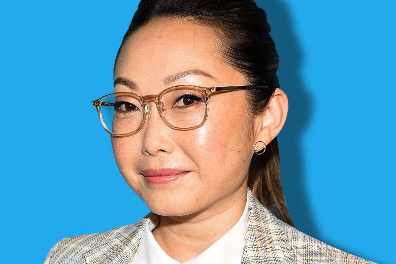 Lulu Wang, wearing stylish glasses and a plaid blazer.