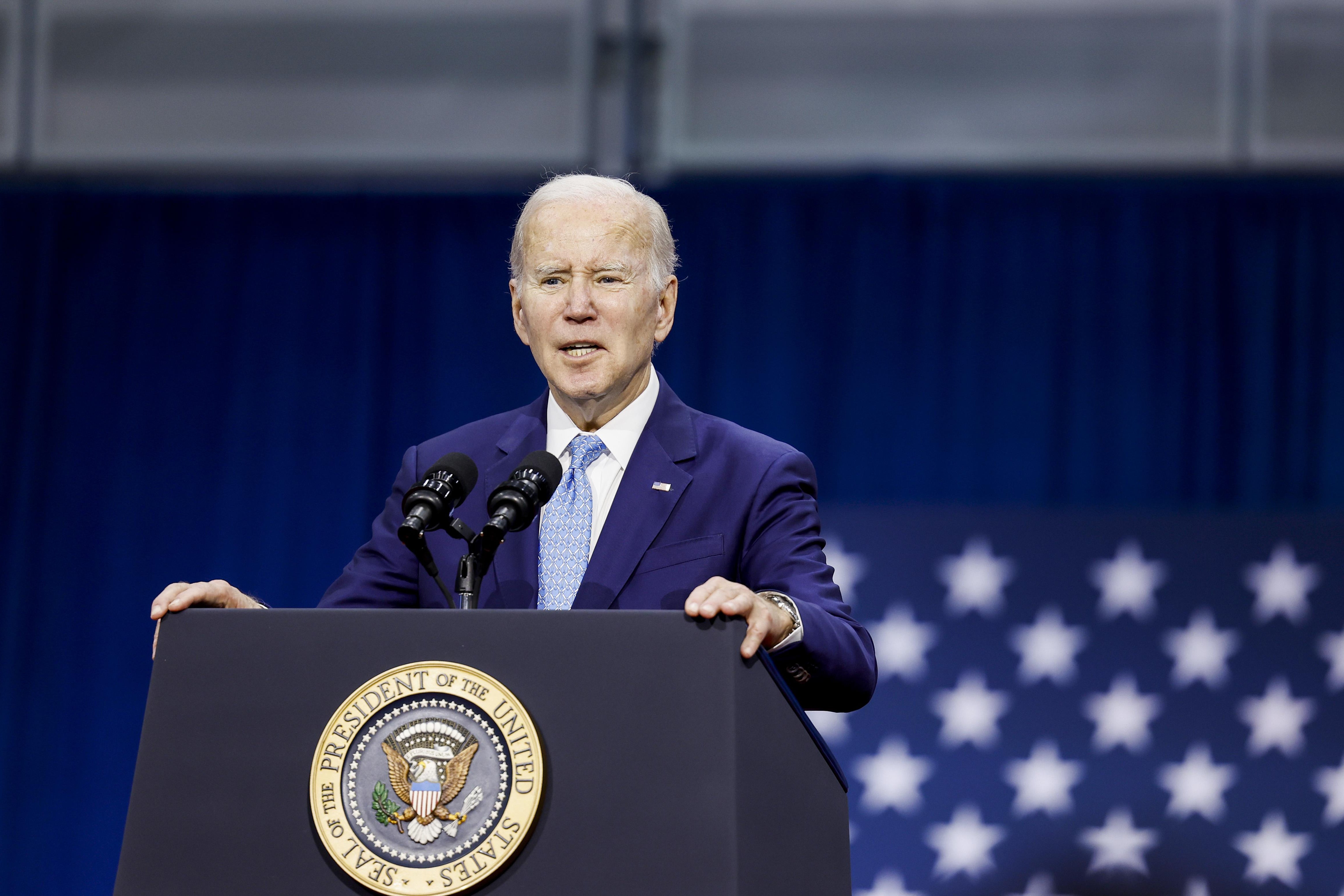 U.S. President Joe Biden delivers remarks, with his hands on a lectern, in Virginia Beach.
