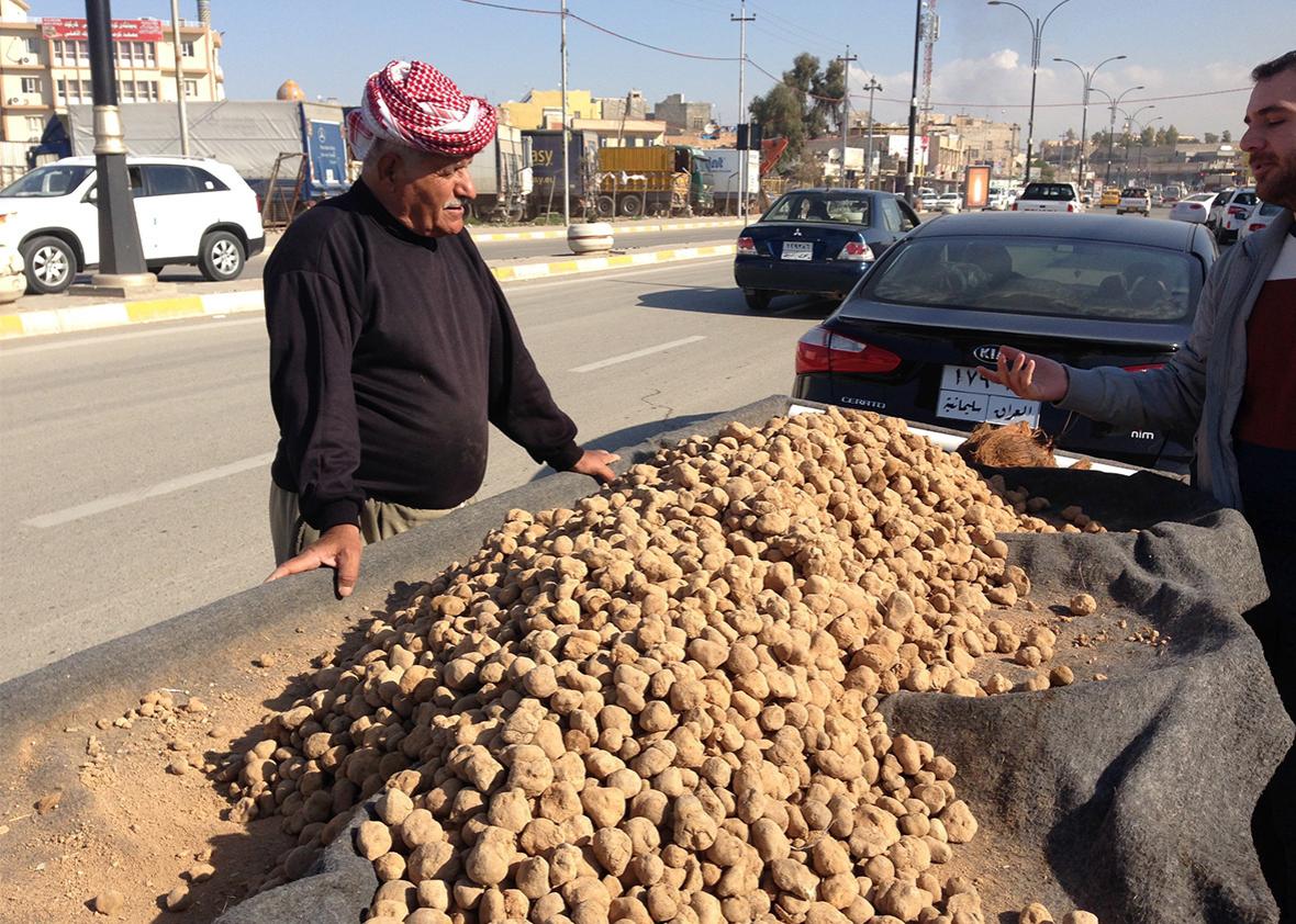 A man sells truffles in Kirkuk. Prices are down this year.