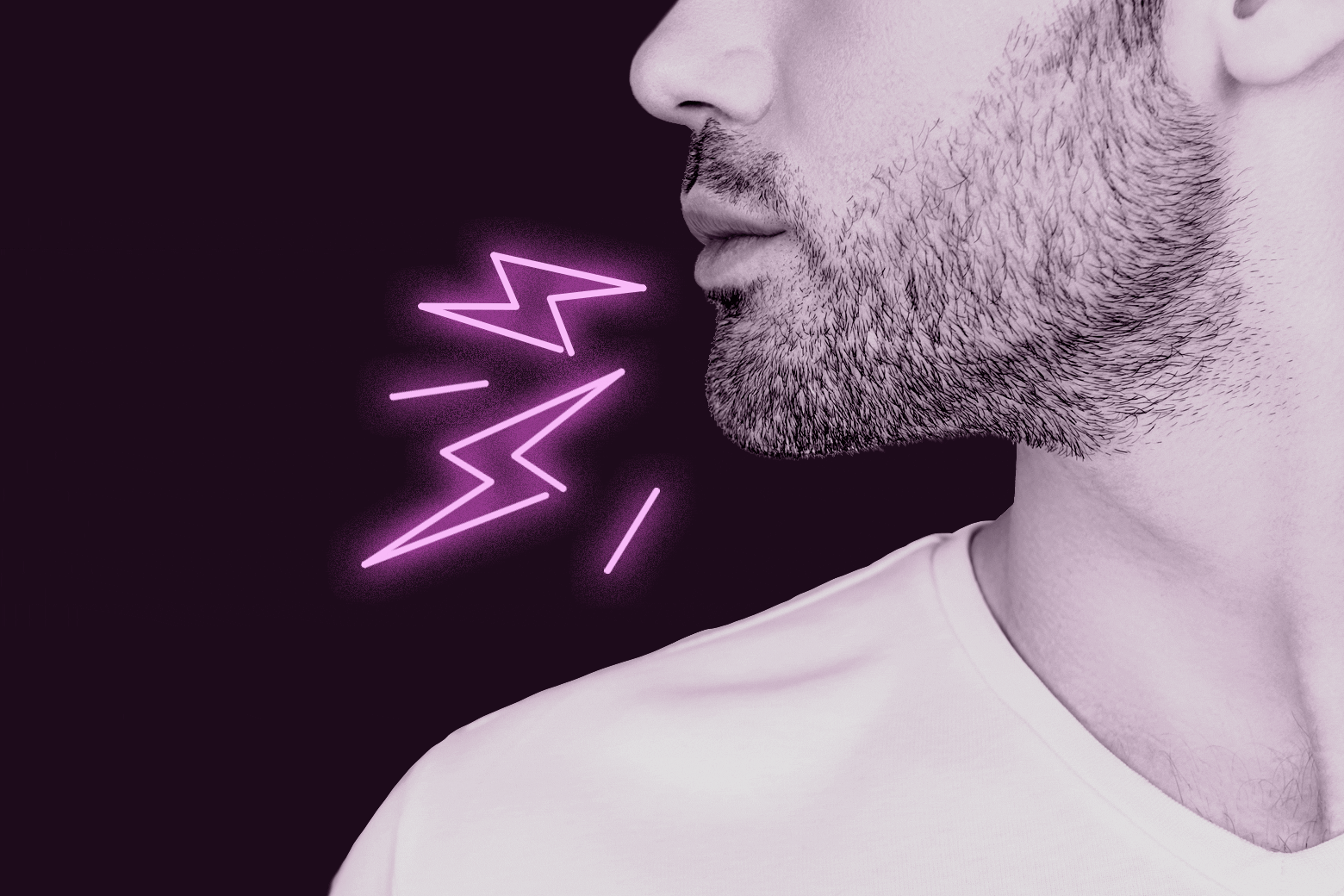 Man with stubble next to some neon shocks pointed at his chin.