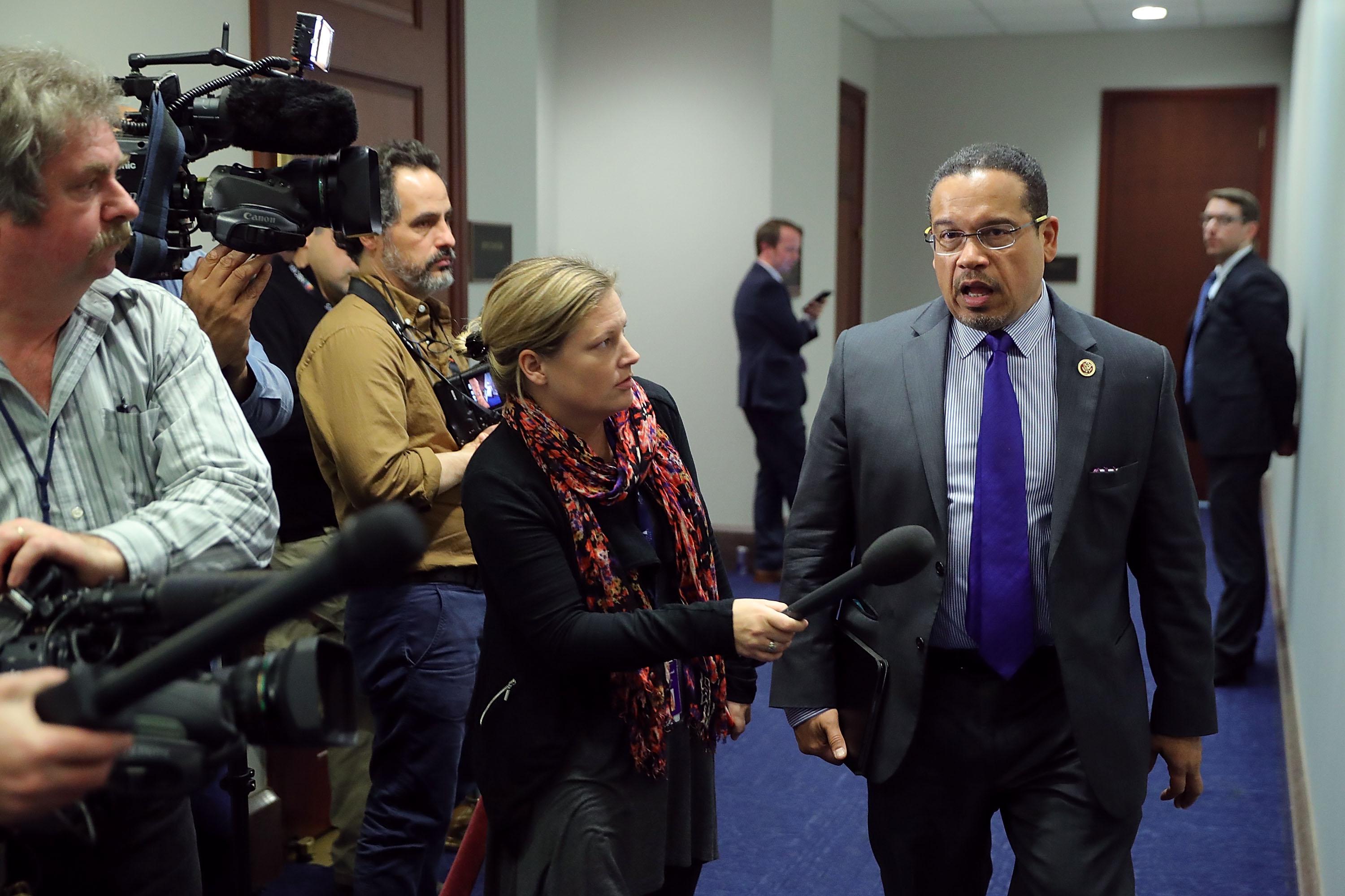 Rep. Keith Ellison talks to reporters as he leaves a House Democratic caucus meeting.