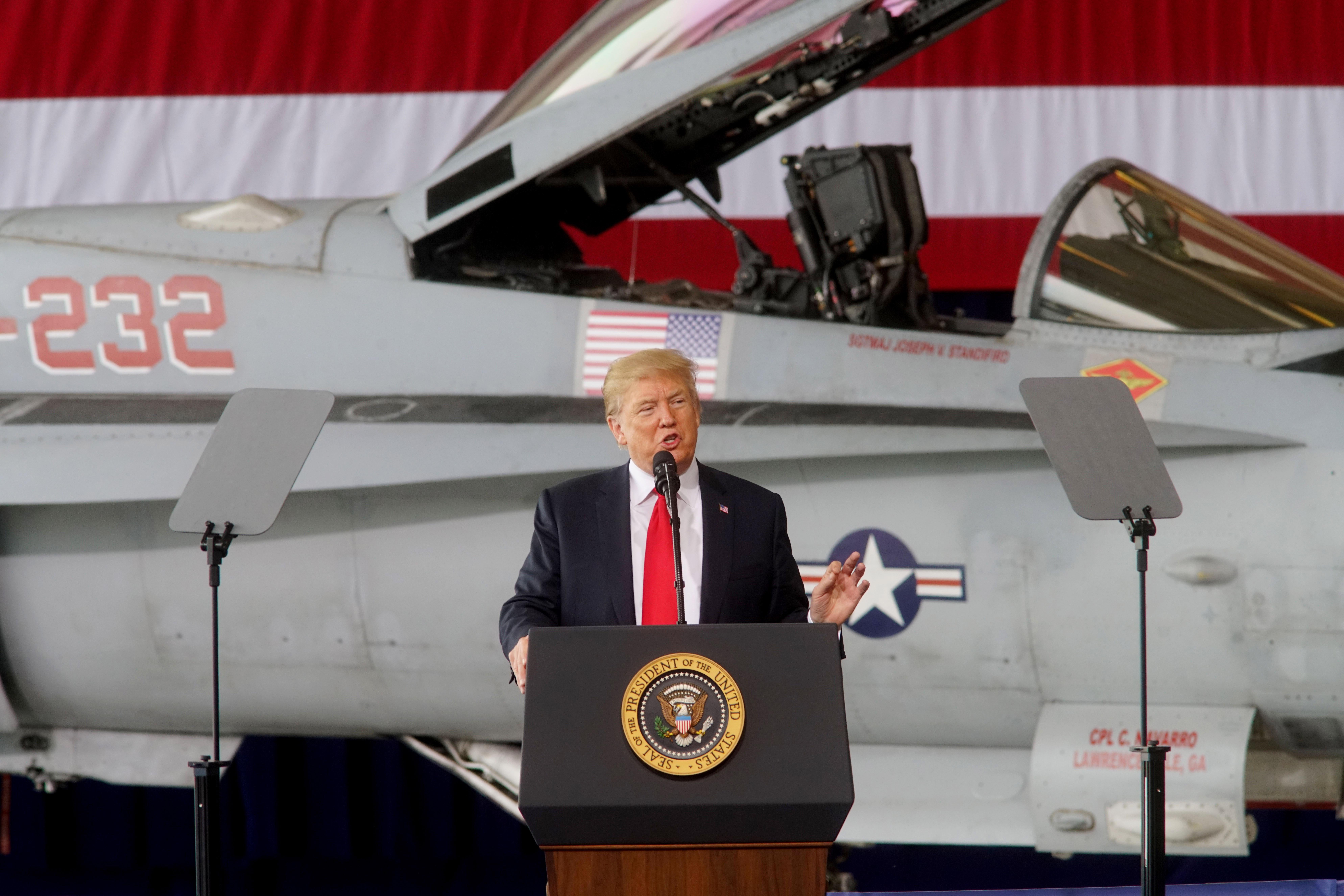 SAN DIEGO, CA - MARCH 13:  President Donald Trump addresses troops at Miramar Marine Corp Air Station on March 13, 2018 in San Diego, California.  President Trump, on his first visit to California, will view the prototype border walls and then attend a fundraiser in Beverly Hills. (Photo by Sandy Huffaker/Getty Images)