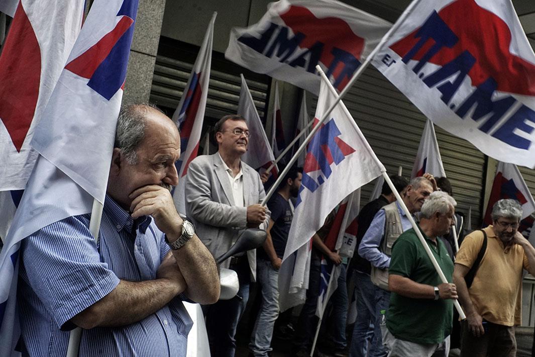 Communist-affiliated PAME workers union protesters block the ent