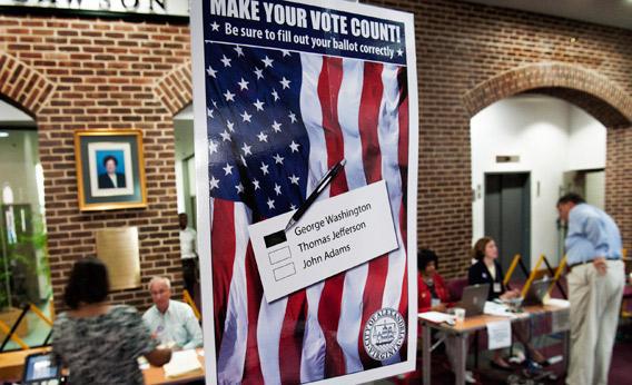 Voters get their ballots at City Hall.
