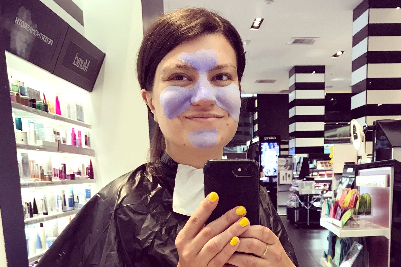 The author in a facial mask at Sephora.