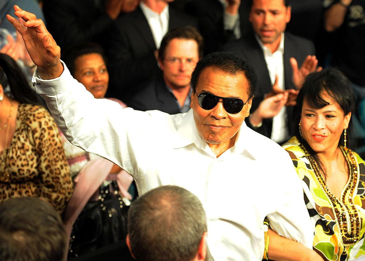 Muhammad Ali salutes the crowd before the 2010 Floyd Mayweather Jr. and Shane Mosley welterweight fight in Las Vegas.