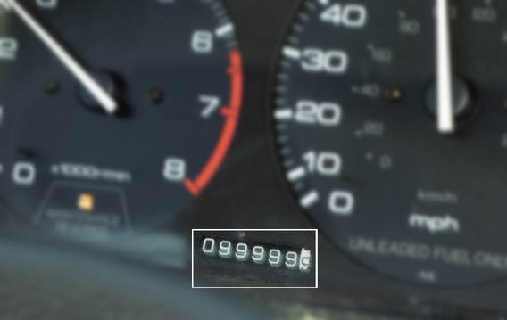 Car odometer about to tick over.