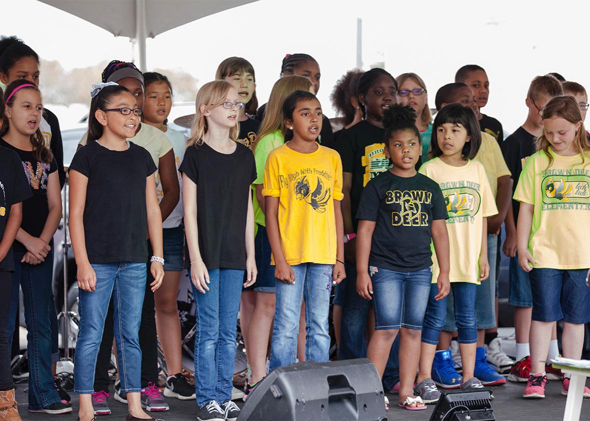 The elementary school choir performs on stage at The Village of ,The elementary school choir performs on stage at The Village of Brown Deer "Eat & Greet on the Street" festival on Saturday June 4, 2016.