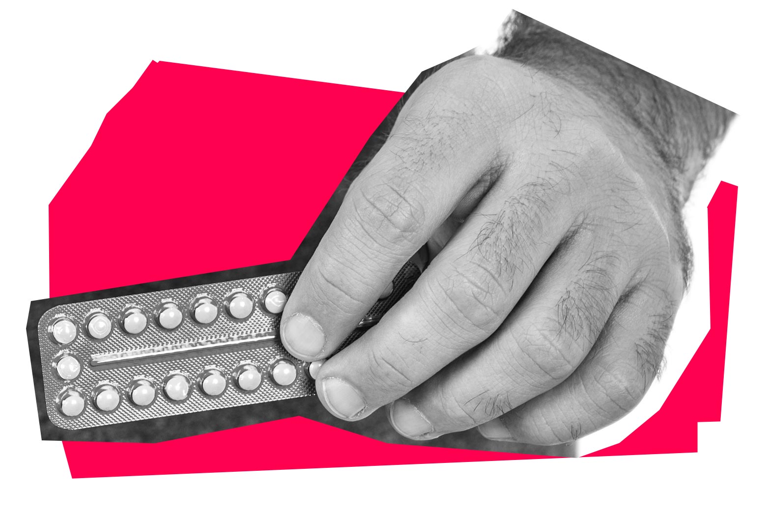 Hand holding a pack of birth control pills