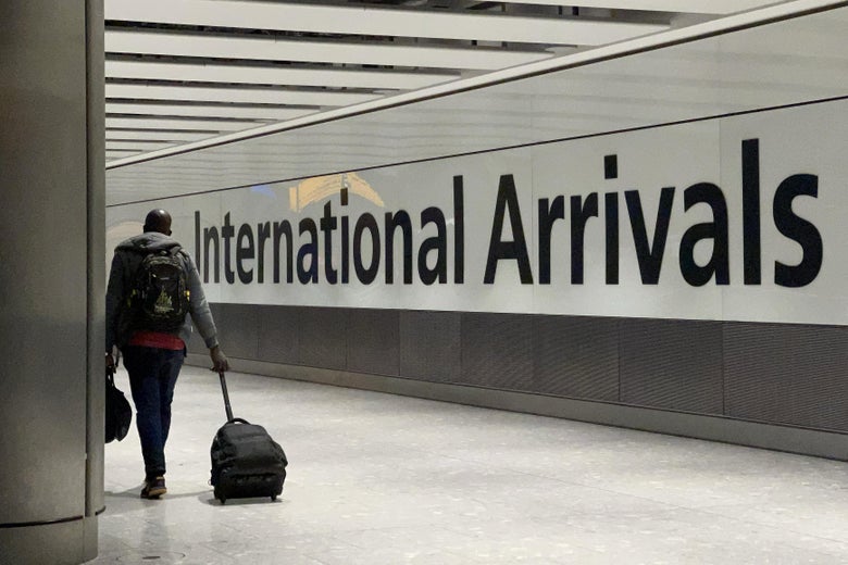 International passengers walk through the arrivals area at Terminal 5 at Heathrow Airport on November 26, 2021 in London, England.