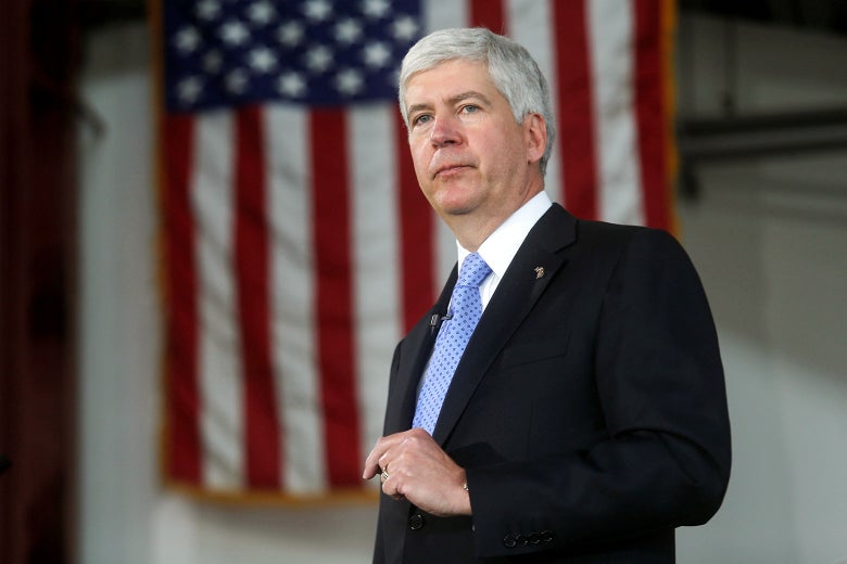 Rick Snyder, with an American flag in the background.