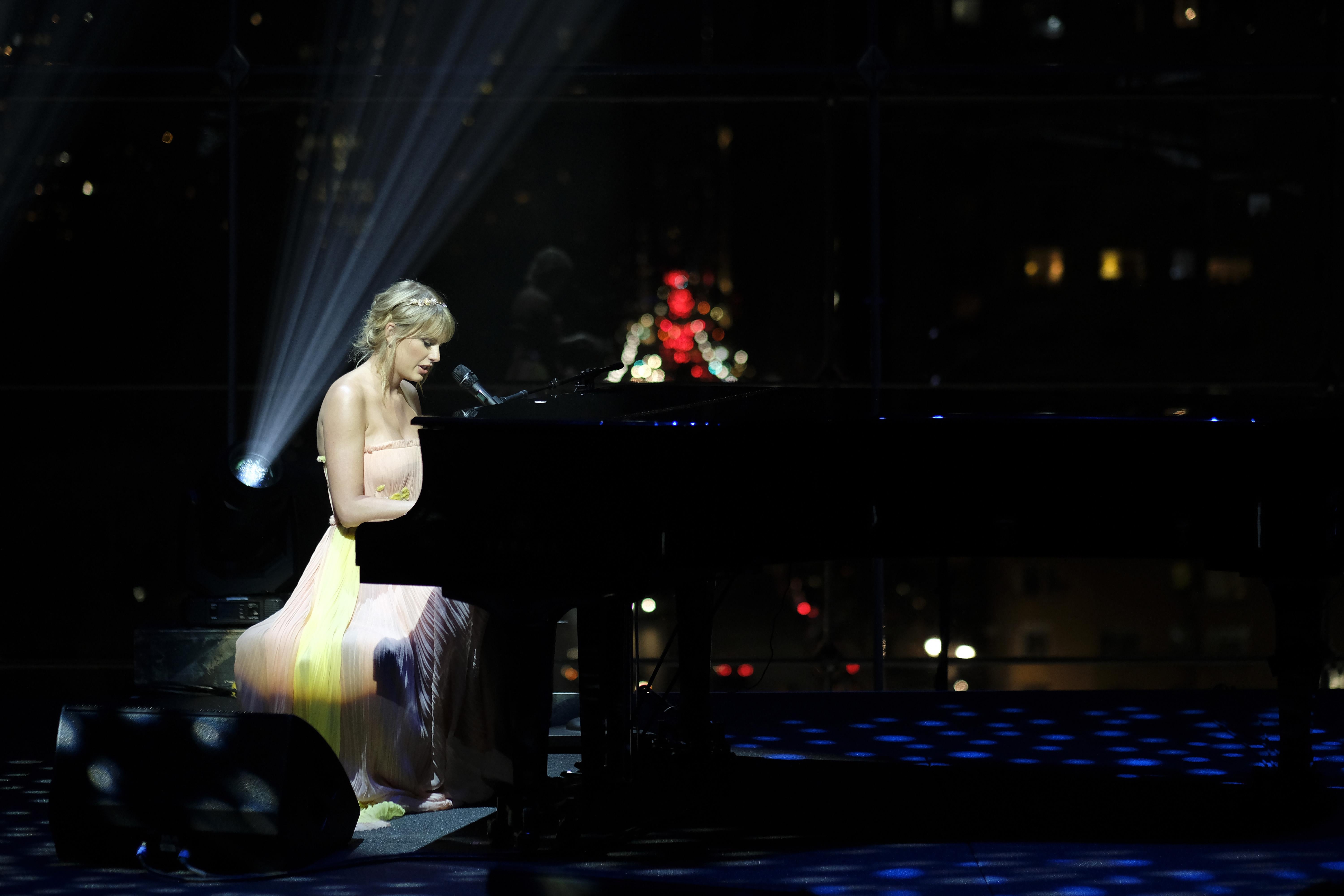 Taylor Swift singing and playing piano onstage at the TIME 100 Gala at Jazz at Lincoln Center in New York City on April 23.