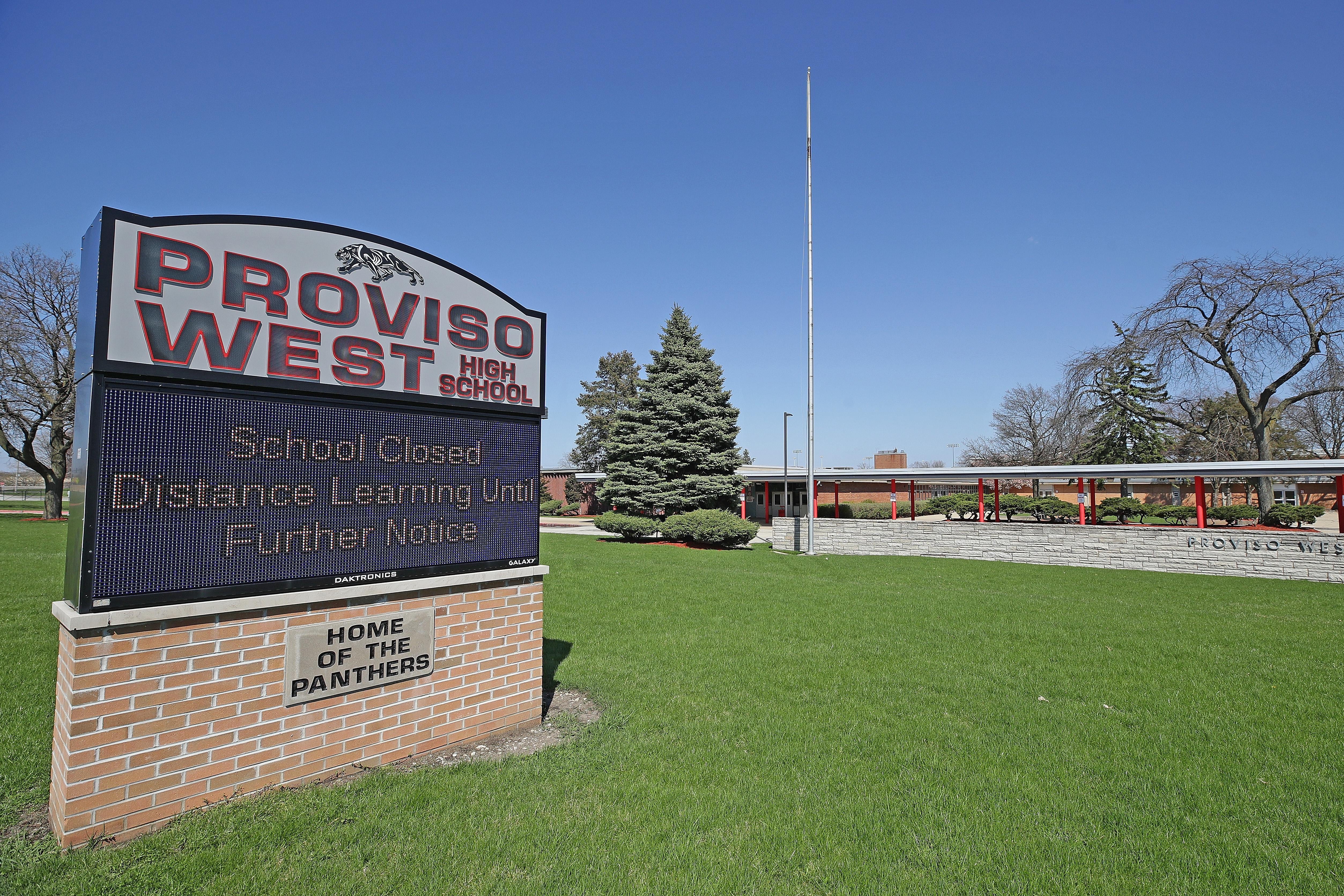 A sign urging students to use distance learning outside of closed Proviso West High School on April 18.