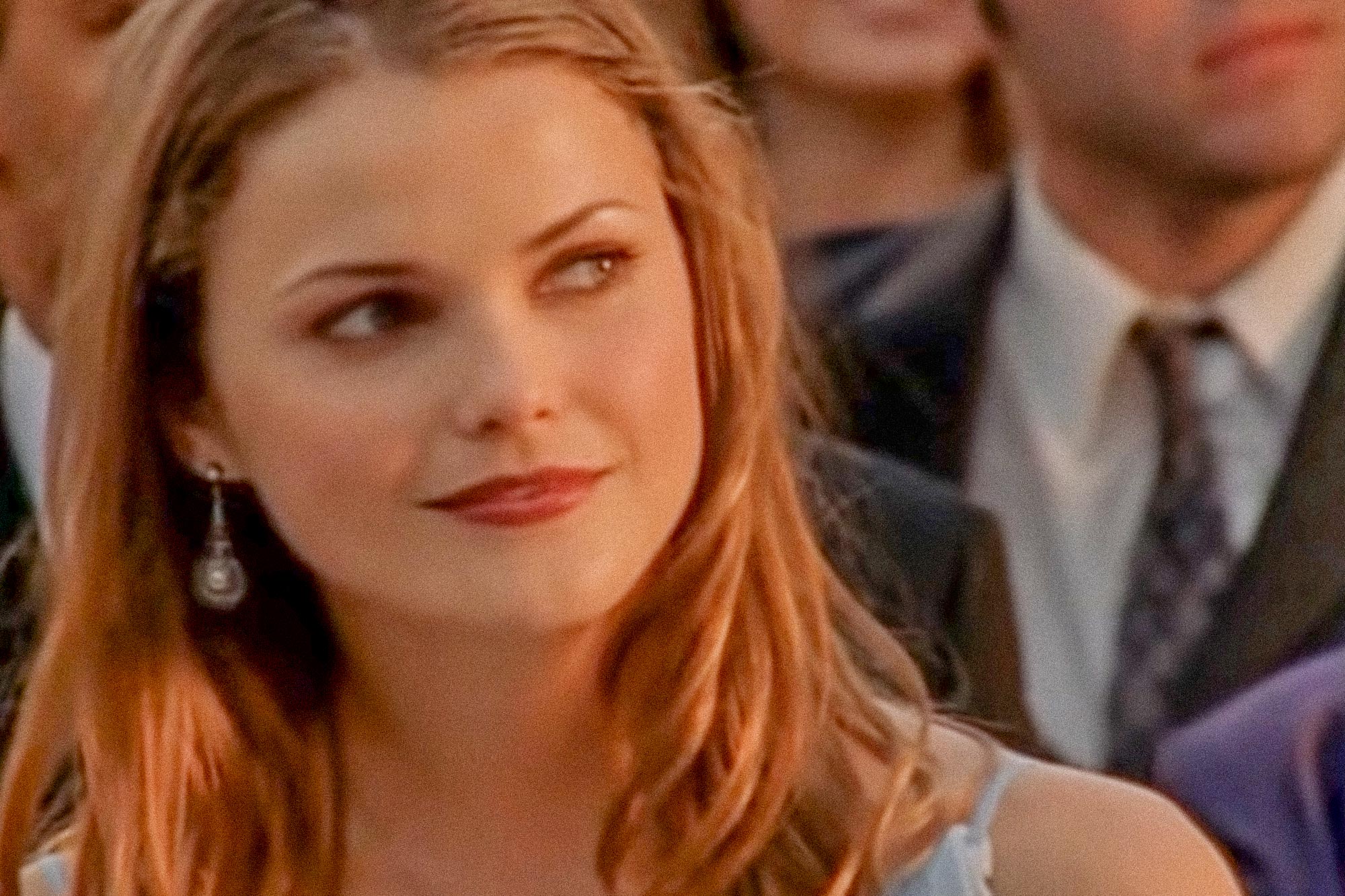 In the Felicity season finale, Keri Russell, with long straight hair, wears a light blue dress and slightly smiles.