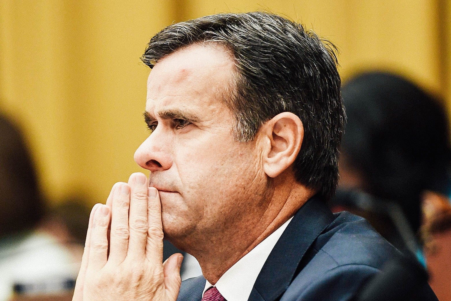Texas Rep. John Ratcliffe leans on his hands while listening to Robert Mueller's House testimony in Washington on July 24.