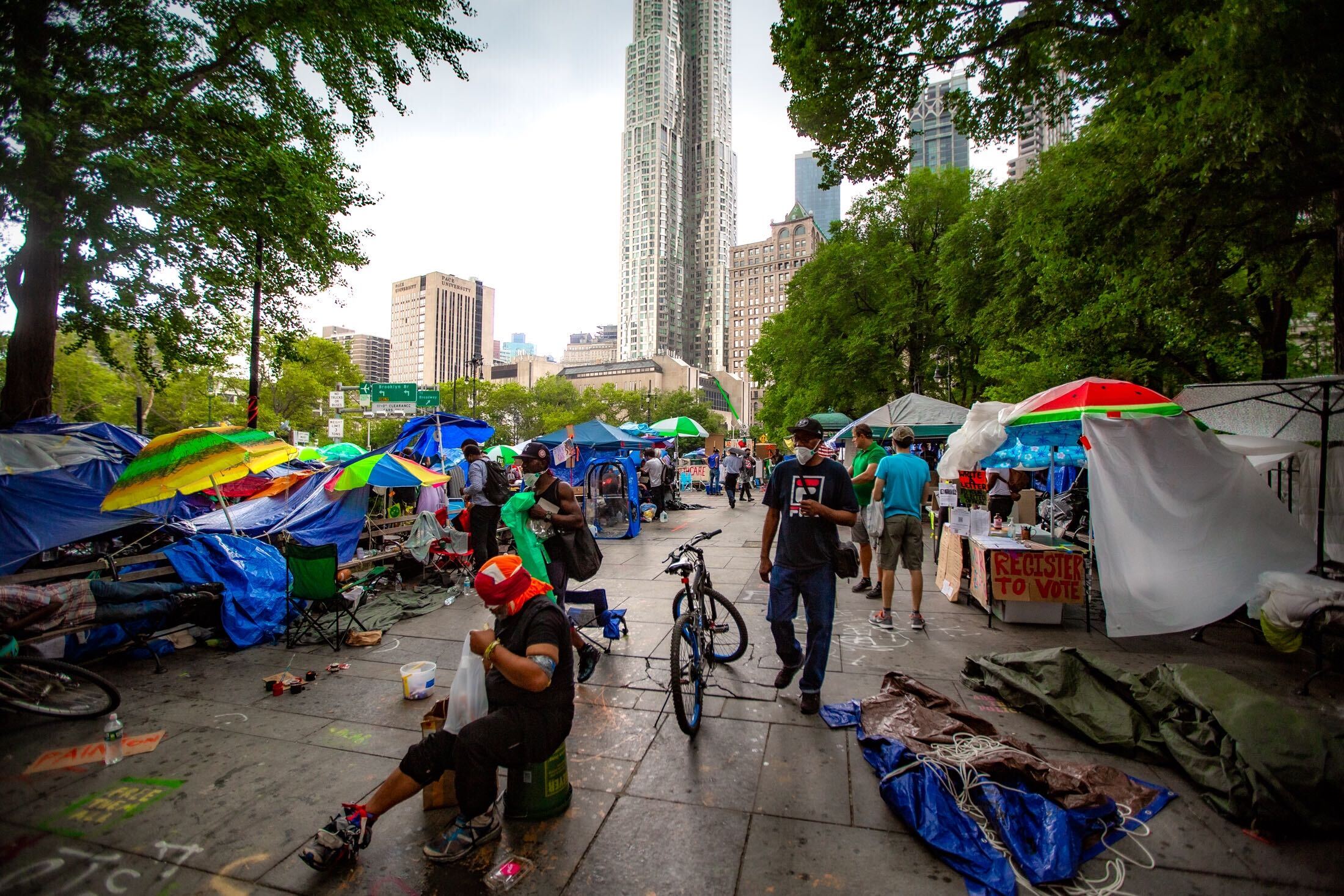 Tents and protesters at Occupy City Hall, with City Hall in the background