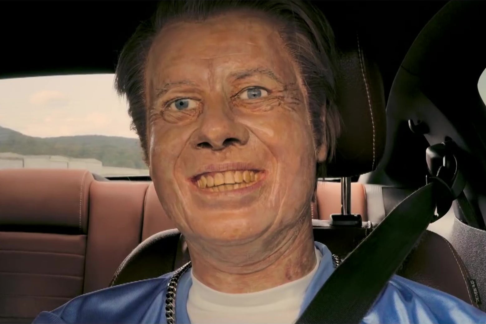 A bad wax statue of Jimmy Carter, posed to look like he's driving a car.