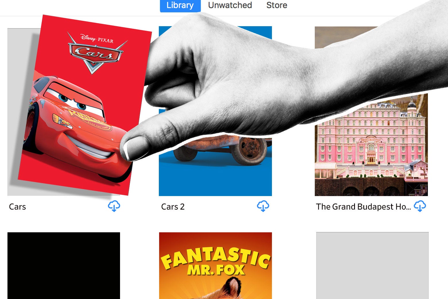 A hand takes a purchased download of the movie cars from iTunes.